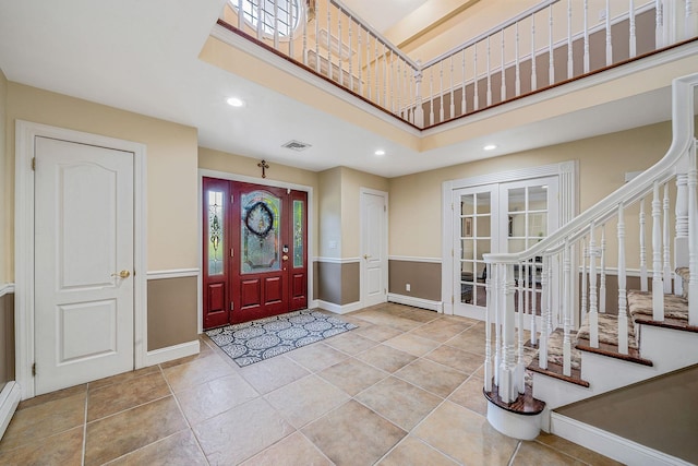 23 Antona Blvd, Centereach, NY 11720 - entryway featuring recessed lighting, a baseboard radiator, stairs, a towering ceiling, and tile patterned floors