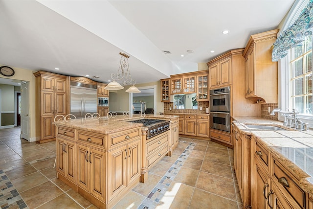 23 Antona Blvd, Centereach, NY 11720 - kitchen with built in appliances, a kitchen island with sink, tasteful backsplash, light stone countertops, and glass insert cabinets
