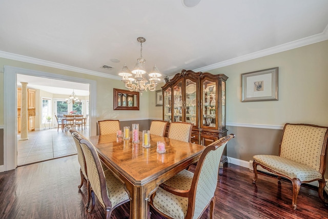 23 Antona Blvd, Centereach, NY 11720 - dining area featuring a chandelier, crown molding, and wood finished floors