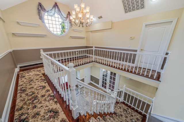 23 Antona Blvd, Centereach, NY 11720 - stairs with vaulted ceiling and a chandelier