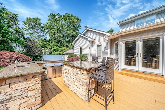 23 Antona Blvd, Centereach, NY 11720 - wooden deck featuring exterior kitchen, french doors, and an outdoor bar