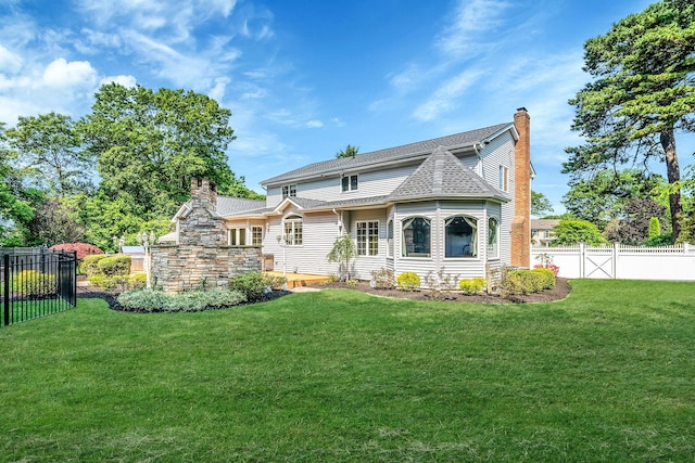23 Antona Blvd, Centereach, NY 11720 - rear view of property with a chimney and roof with shingles