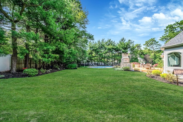 23 Antona Blvd, Centereach, NY 11720 - view of yard featuring an outdoor pool and a fireplace