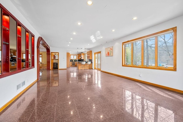 64-16 211th St, Bayside, NY 11364 - unfurnished living room with granite floors and recessed lighting