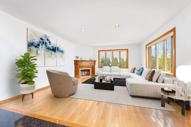 64-16 211th St, Bayside, NY 11364 - living area featuring hardwood / wood-style floors, recessed lighting, and a lit fireplace