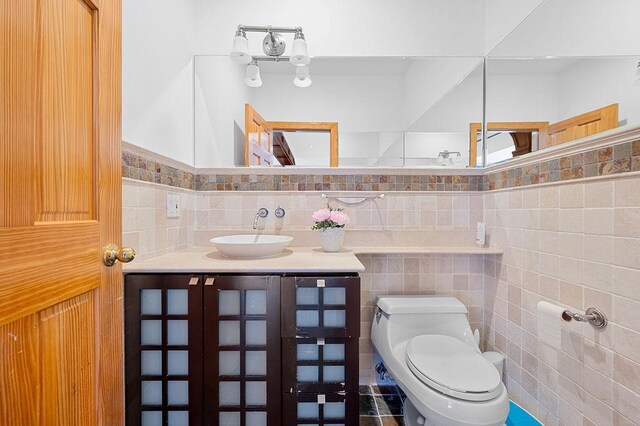 64-16 211th St, Bayside, NY 11364 - bathroom featuring tile walls and vanity
