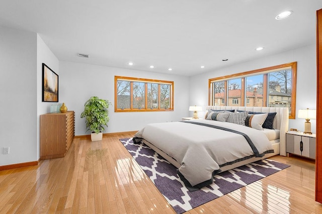 64-16 211th St, Bayside, NY 11364 - bedroom featuring multiple windows, light wood finished floors, and recessed lighting