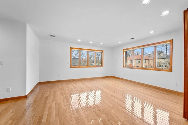 64-16 211th St, Bayside, NY 11364 - unfurnished room featuring light wood-style flooring, plenty of natural light, and recessed lighting