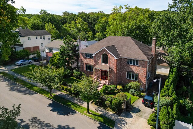 64-16 211th St, Bayside, NY 11364 - view of subject property with a heavily wooded area