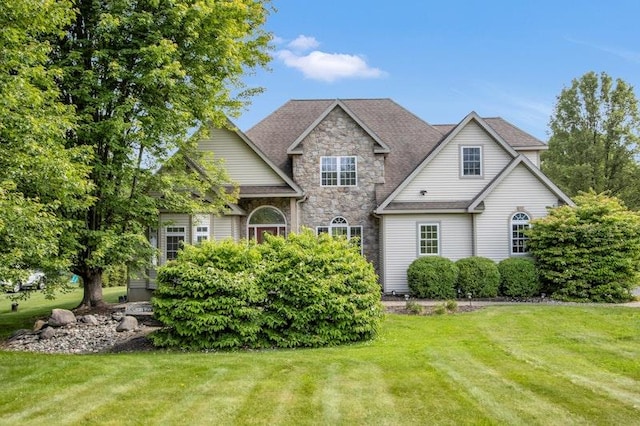 32 Gellatly Dr, Wappingers Falls, NY 12590 - view of front facade featuring stone siding and a front lawn