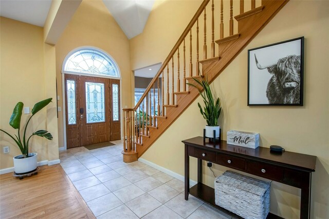 32 Gellatly Dr, Wappingers Falls, NY 12590 - foyer entrance featuring stairs, high vaulted ceiling, and light wood finished floors