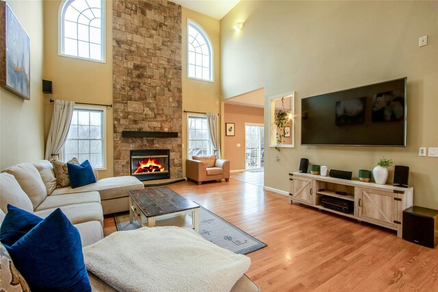 32 Gellatly Dr, Wappingers Falls, NY 12590 - living area with a towering ceiling, light wood finished floors, and a fireplace