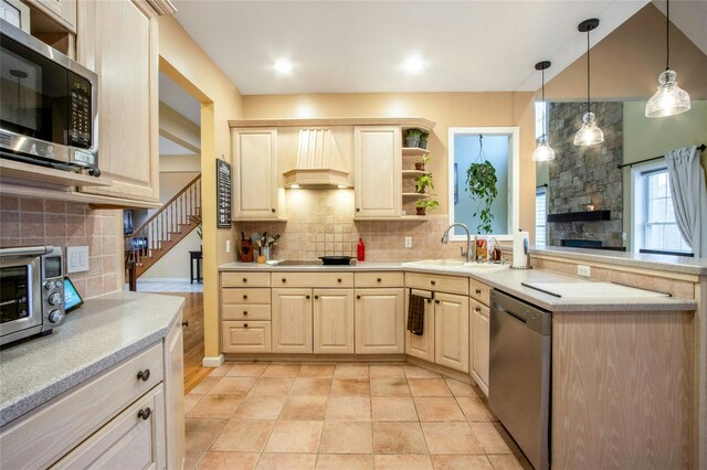 32 Gellatly Dr, Wappingers Falls, NY 12590 - kitchen with stainless steel appliances, custom exhaust hood, light brown cabinetry, open shelves, and tasteful backsplash