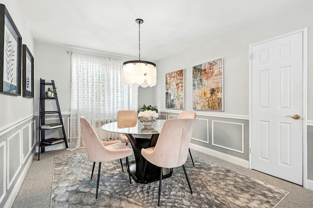 1 Avon Cir Unit D, Rye Brook, NY 10573 - dining area featuring a decorative wall, a chandelier, carpet flooring, and wainscoting