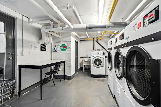 1 Avon Cir Unit D, Rye Brook, NY 10573 - communal laundry room with independent washer and dryer and concrete block wall