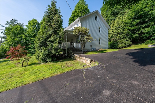 414 Bear Ridge Rd, Pleasantville, NY 10570 - view of front of home with a front yard and covered porch