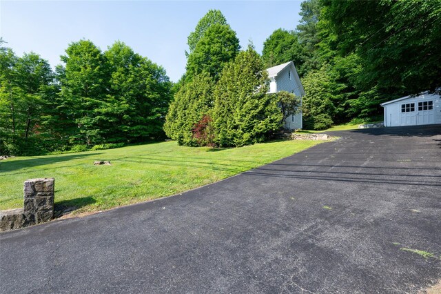 414 Bear Ridge Rd, Pleasantville, NY 10570 - view of green lawn featuring asphalt driveway