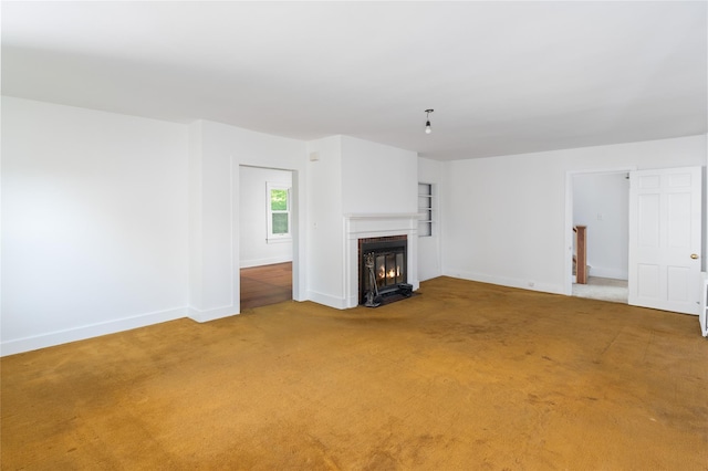 414 Bear Ridge Rd, Pleasantville, NY 10570 - unfurnished living room with light carpet and a fireplace with flush hearth