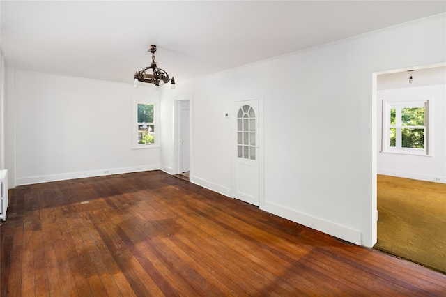 414 Bear Ridge Rd, Pleasantville, NY 10570 - empty room with a chandelier, healthy amount of natural light, and dark wood-style floors
