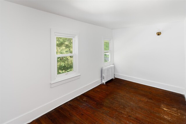 414 Bear Ridge Rd, Pleasantville, NY 10570 - unfurnished room featuring radiator heating unit and dark wood-style floors