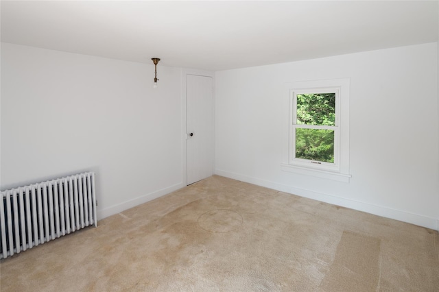 414 Bear Ridge Rd, Pleasantville, NY 10570 - carpeted spare room featuring radiator and baseboards