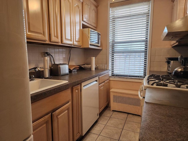 2251 Plumb 1st St Unit 6B, Brooklyn, NY 11229 - kitchen with dishwasher, wall chimney exhaust hood, tasteful backsplash, dark countertops, and light tile patterned flooring