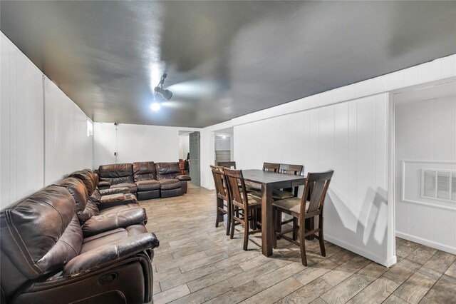 189 Stanton Blvd, Uniondale, NY 11553 - living area with a decorative wall and light wood-style floors