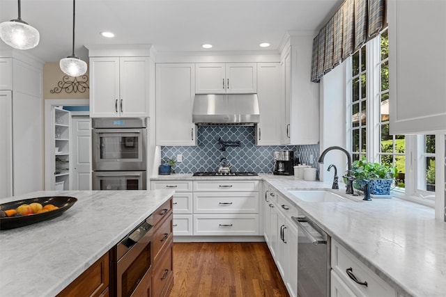 41 Carlton Dr, Mount Kisco, NY 10549 - kitchen with appliances with stainless steel finishes, healthy amount of natural light, white cabinets, and recessed lighting