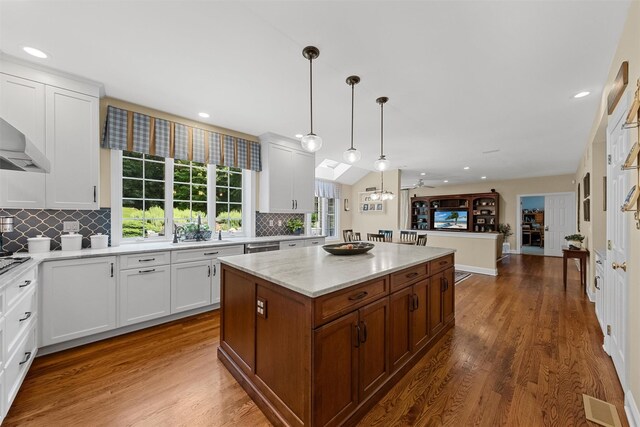41 Carlton Dr, Mount Kisco, NY 10549 - kitchen with a kitchen island, dark wood-type flooring, decorative backsplash, white cabinetry, and recessed lighting