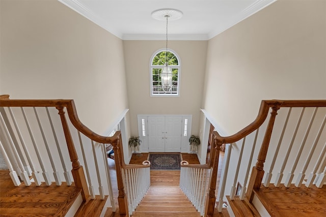 41 Carlton Dr, Mount Kisco, NY 10549 - entrance foyer with wood finished floors, stairs, and ornamental molding