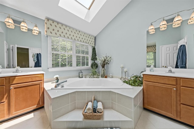 41 Carlton Dr, Mount Kisco, NY 10549 - bathroom featuring a skylight, tile patterned floors, two vanities, a garden tub, and high vaulted ceiling