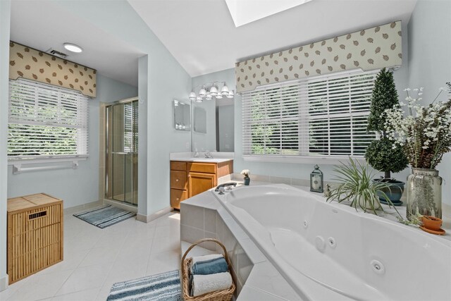 41 Carlton Dr, Mount Kisco, NY 10549 - bathroom featuring vanity, a stall shower, a jetted tub, a skylight, and tile patterned floors