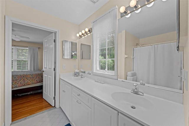 41 Carlton Dr, Mount Kisco, NY 10549 - bathroom with healthy amount of natural light, double vanity, tile patterned flooring, and ensuite bathroom