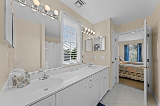41 Carlton Dr, Mount Kisco, NY 10549 - bathroom with double vanity, tile patterned flooring, and ensuite bathroom