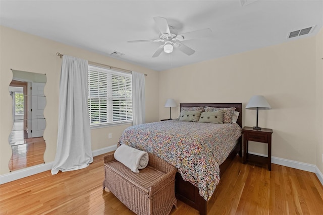 41 Carlton Dr, Mount Kisco, NY 10549 - bedroom with light wood-style floors, multiple windows, and a ceiling fan