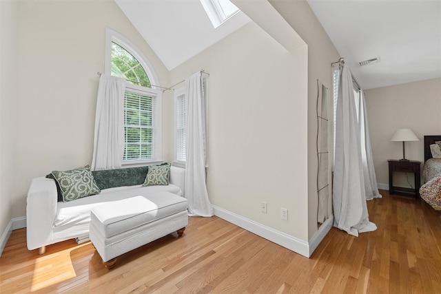 41 Carlton Dr, Mount Kisco, NY 10549 - living area featuring a skylight, light wood-type flooring, and vaulted ceiling