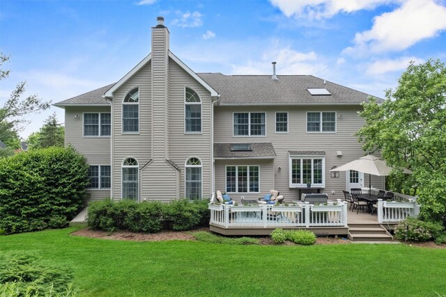 41 Carlton Dr, Mount Kisco, NY 10549 - back of property featuring an outdoor living space, a yard, a wooden deck, a chimney, and outdoor dining area