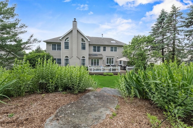 41 Carlton Dr, Mount Kisco, NY 10549 - rear view of property with a chimney and a wooden deck