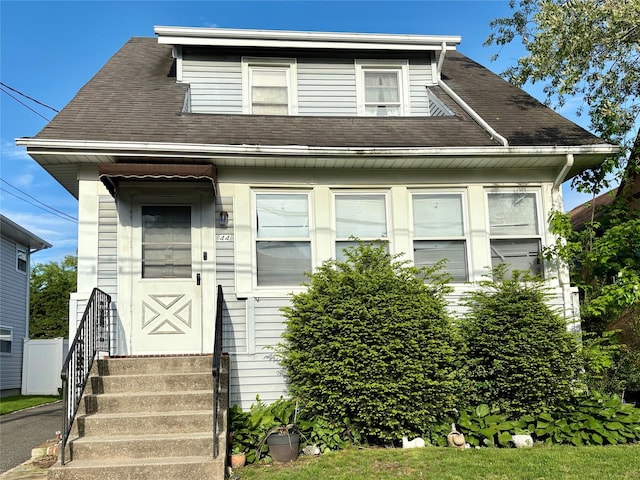 44 Waldo Ave, East Rockaway, NY 11518 - view of front facade featuring roof with shingles and entry steps