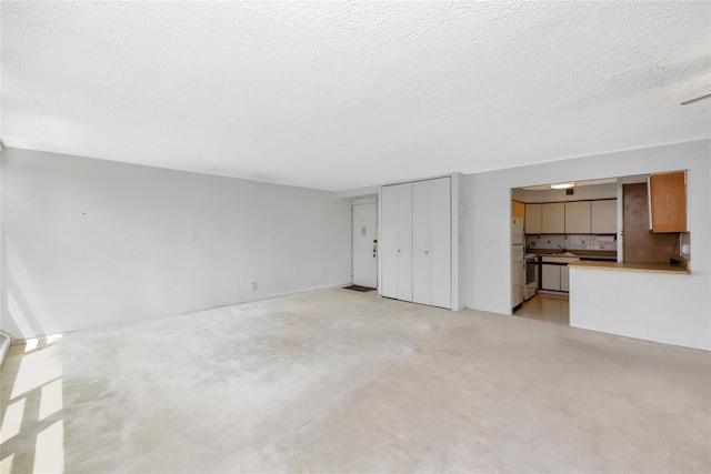 16641 Powells Cove Blvd Unit 6A, Beechhurst, NY 11357 - unfurnished living room with a textured ceiling