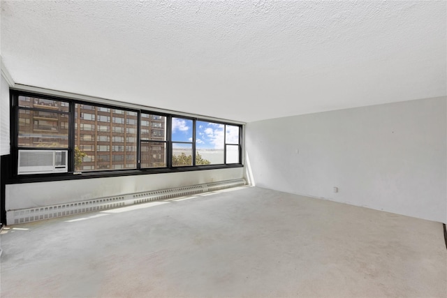 16641 Powells Cove Blvd Unit 6A, Beechhurst, NY 11357 - unfurnished room with a textured ceiling and a baseboard heating unit