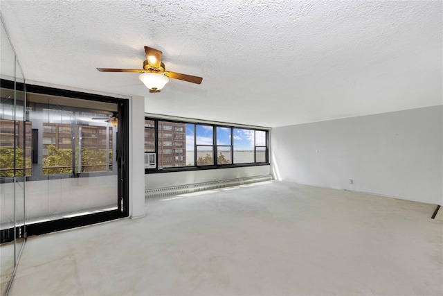 16641 Powells Cove Blvd Unit 6A, Beechhurst, NY 11357 - unfurnished room featuring ceiling fan, a textured ceiling, and baseboard heating