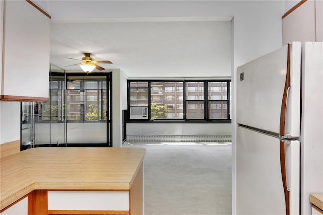 16641 Powells Cove Blvd Unit 6A, Beechhurst, NY 11357 - kitchen featuring freestanding refrigerator, ceiling fan, carpet floors, baseboard heating, and cooling unit