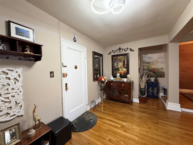 143-50 Hoover Ave Unit 302, Bayside, NY 11435 - foyer entrance with light wood finished floors and baseboards