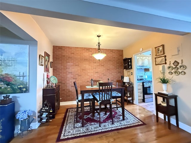 143-50 Hoover Ave Unit 302, Bayside, NY 11435 - dining space with wood finished floors and brick wall