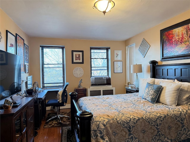 143-50 Hoover Ave Unit 302, Bayside, NY 11435 - bedroom with dark wood-style floors, an office area, and cooling unit