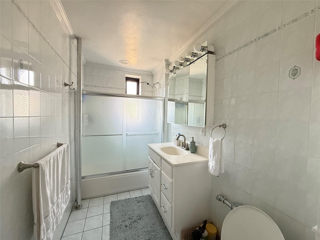 143-50 Hoover Ave Unit 302, Bayside, NY 11435 - bathroom featuring crown molding, tile walls, vanity, and tile patterned floors