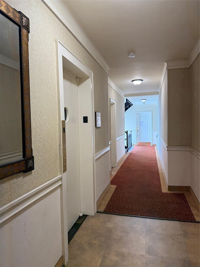 143-50 Hoover Ave Unit 302, Bayside, NY 11435 - corridor featuring elevator, ornamental molding, and a textured wall