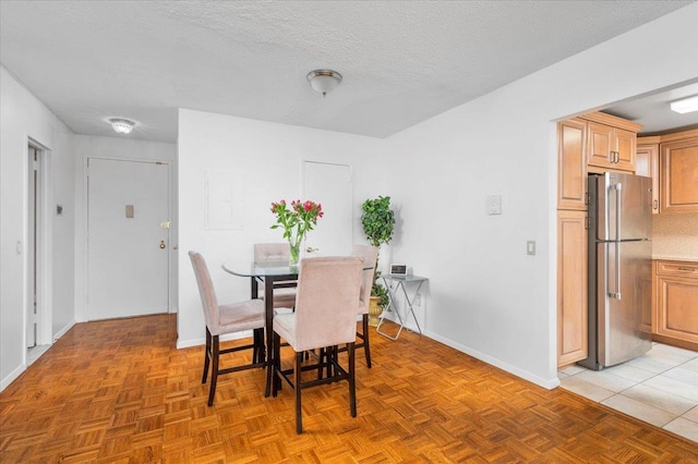 1270 N Ave Unit 5A, New Rochelle, NY 10804 - dining area with baseboards and a textured ceiling