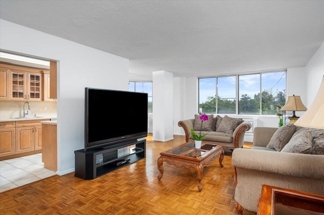 1270 N Ave Unit 5A, New Rochelle, NY 10804 - living room featuring a textured ceiling